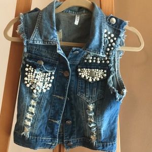Small denim vest embellished in pearls